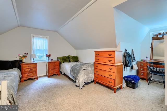 bedroom featuring carpet floors and vaulted ceiling