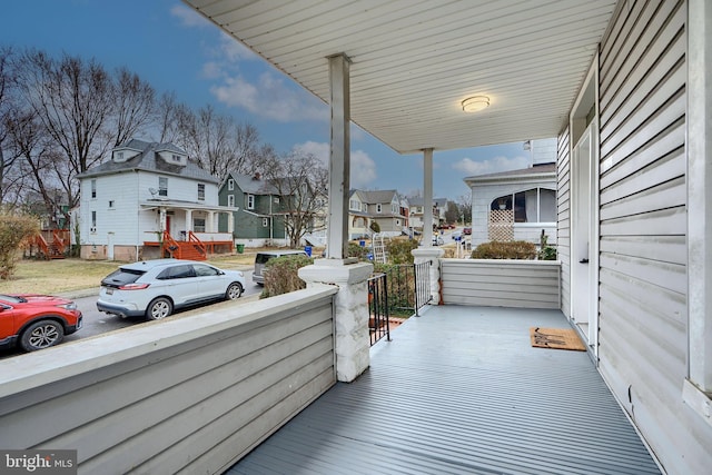 balcony featuring a porch and a residential view