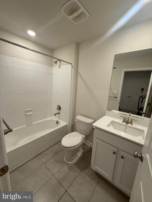 bathroom with  shower combination, vanity, toilet, and tile patterned floors