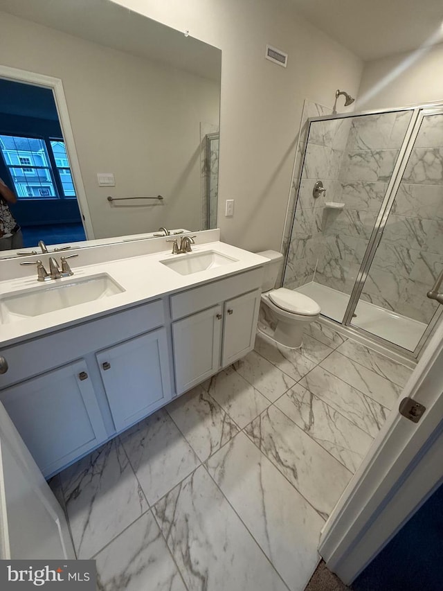 bathroom with marble finish floor, visible vents, and a sink