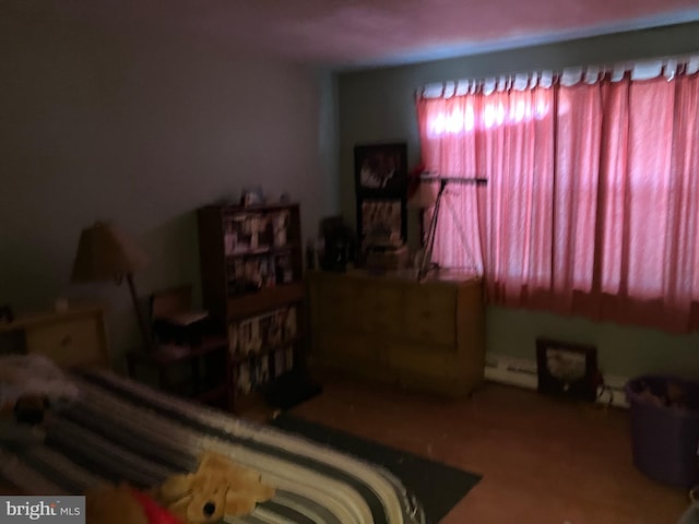 bedroom featuring a baseboard heating unit