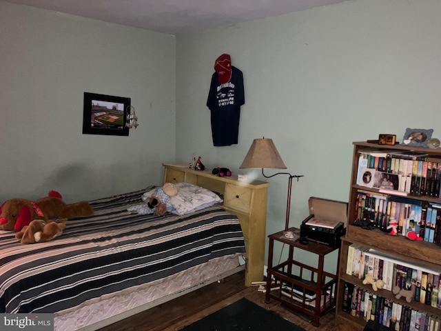 bedroom featuring wood finished floors