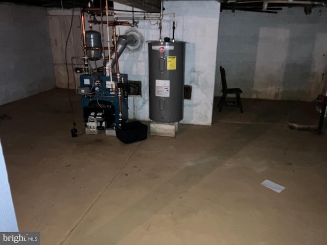 utility room featuring a heating unit and electric water heater