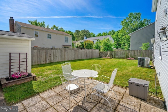 view of patio / terrace with outdoor dining area, central AC, and a fenced backyard