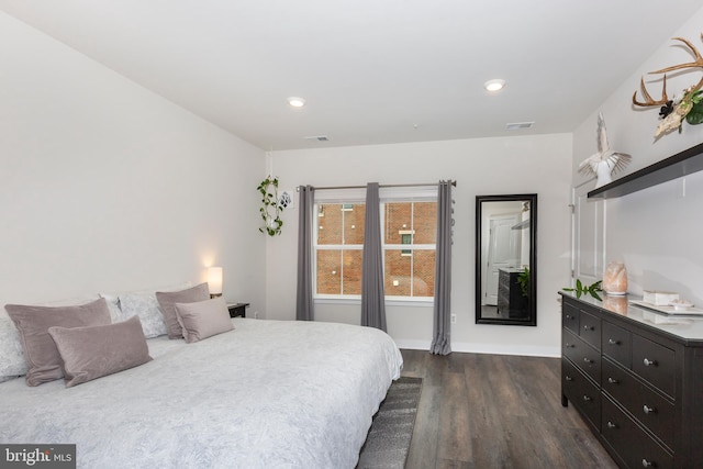 bedroom with dark wood-style floors, baseboards, visible vents, and recessed lighting