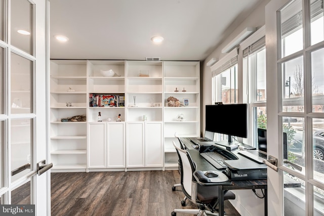 office space with dark wood-style floors, french doors, visible vents, and a healthy amount of sunlight