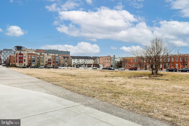 view of yard featuring a view of city