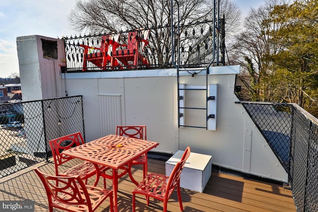 deck featuring fence and outdoor dining space