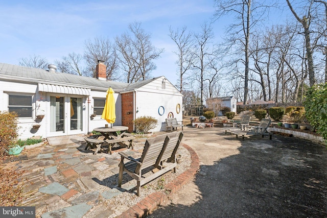 view of patio with driveway and french doors