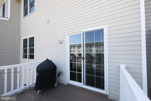 wooden terrace with area for grilling