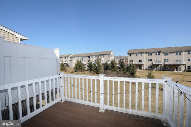 wooden terrace featuring a residential view