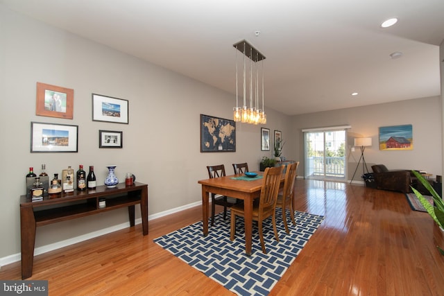 dining room with recessed lighting, baseboards, and light wood-style floors