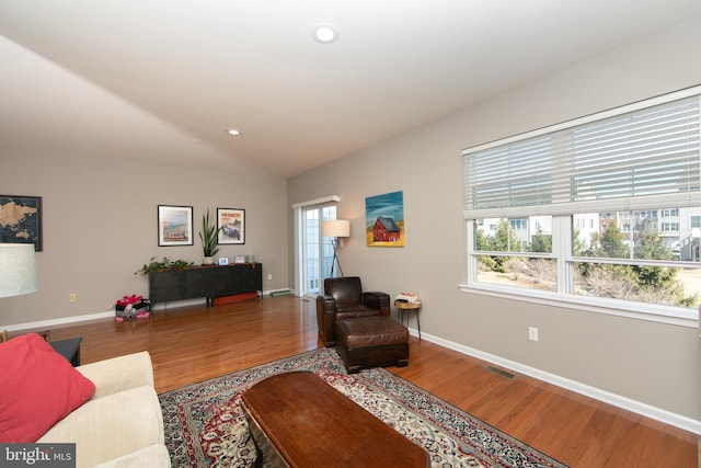 living area with visible vents, recessed lighting, wood finished floors, and baseboards