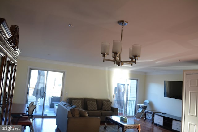 living room with a notable chandelier, dark wood-style floors, and crown molding