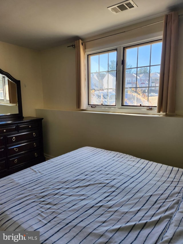 unfurnished bedroom with visible vents