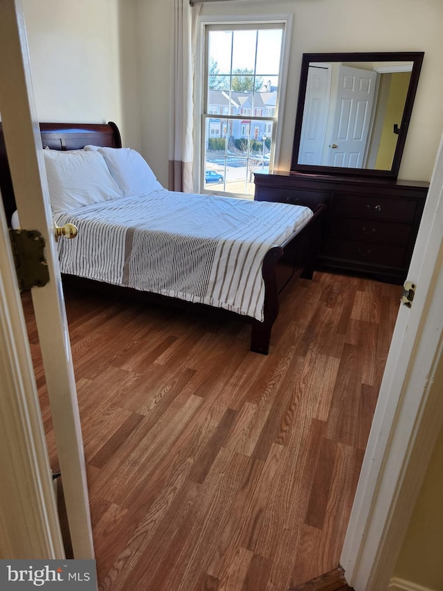 bedroom featuring wood finished floors