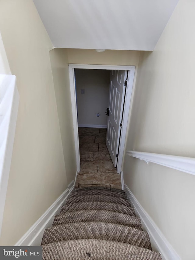 stairway with baseboards