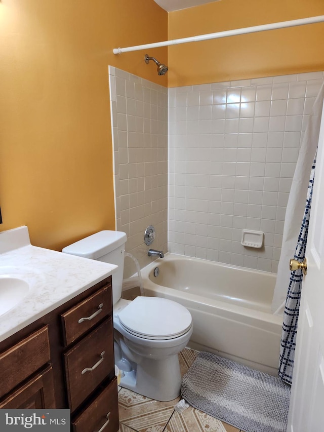 full bathroom featuring shower / tub combo with curtain, vanity, toilet, and tile patterned floors