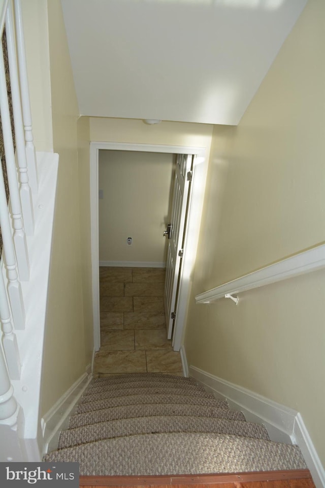 stairway with baseboards