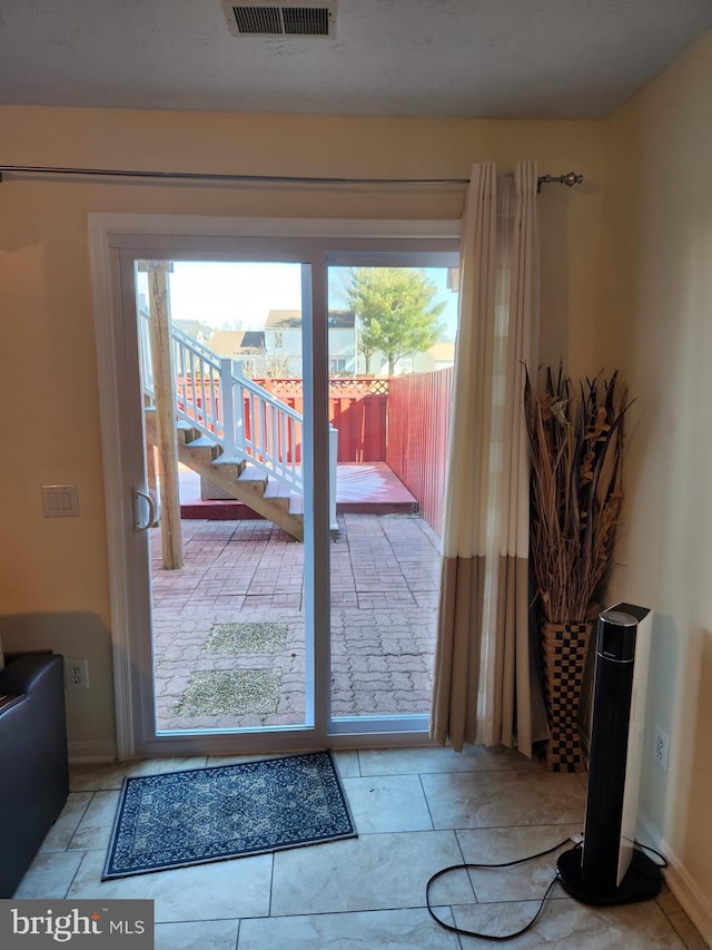 entryway with stairway and visible vents