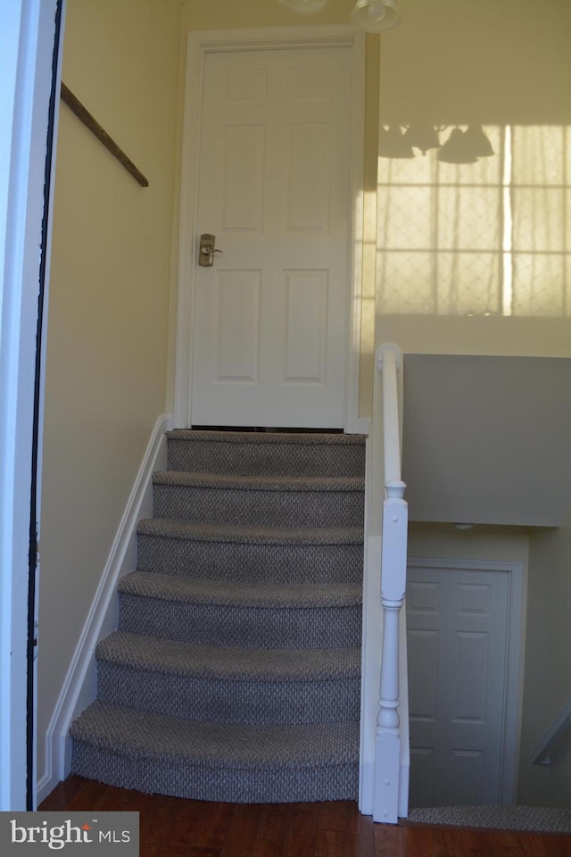 stairway with baseboards