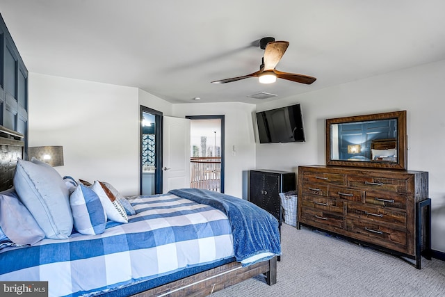 bedroom with light carpet, visible vents, and a ceiling fan