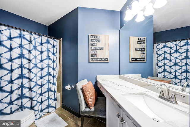 bathroom featuring toilet, vanity, a chandelier, a shower with curtain, and tile patterned floors