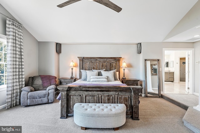 bedroom featuring carpet flooring, vaulted ceiling, baseboards, and ceiling fan