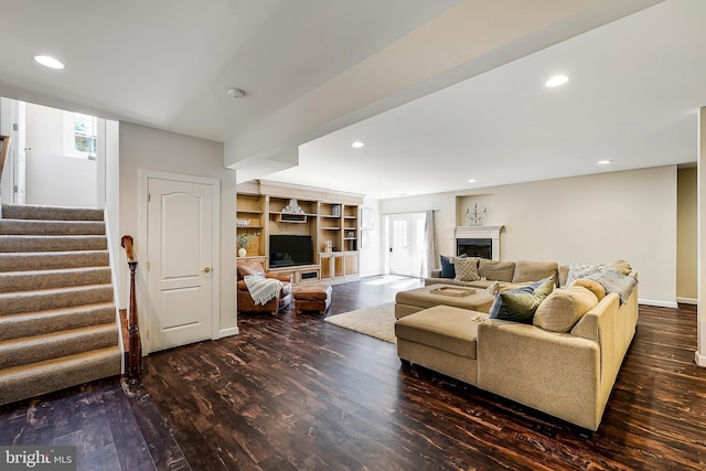 living room with stairway, a fireplace, wood finished floors, and recessed lighting