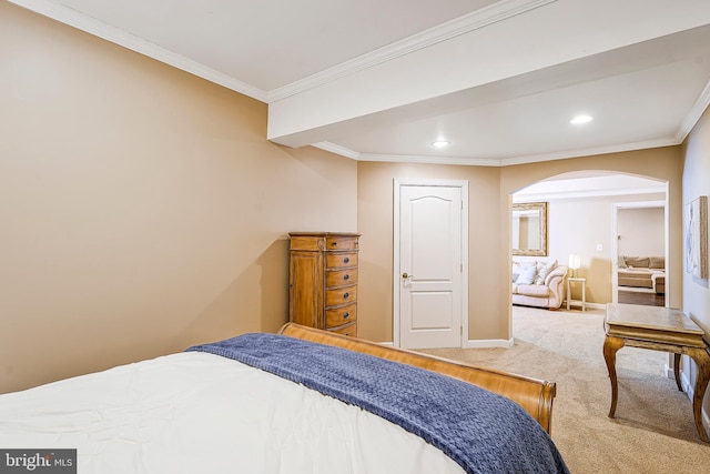 bedroom with arched walkways, recessed lighting, ornamental molding, carpet flooring, and baseboards