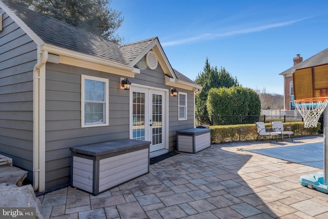 view of patio featuring french doors and fence