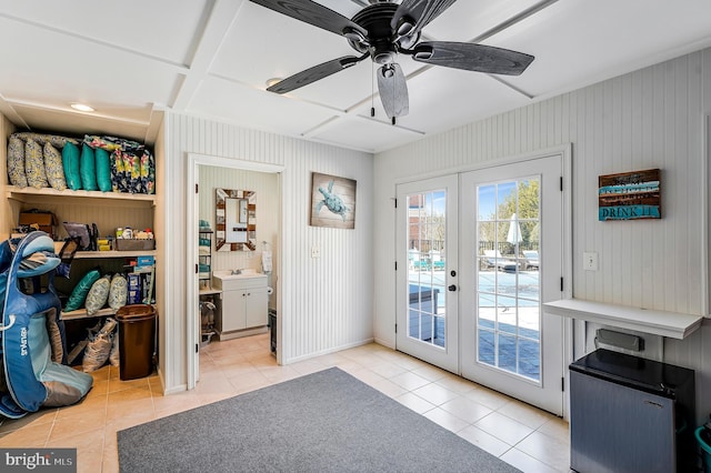 entryway featuring tile patterned flooring, french doors, and ceiling fan