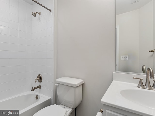 bathroom with toilet, vanity, and bathing tub / shower combination