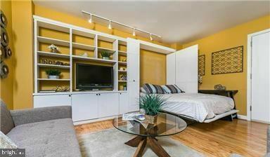 bedroom with wood finished floors