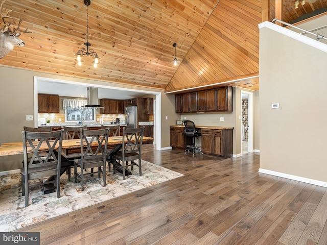 dining room with baseboards, wooden ceiling, dark wood-style flooring, high vaulted ceiling, and built in desk