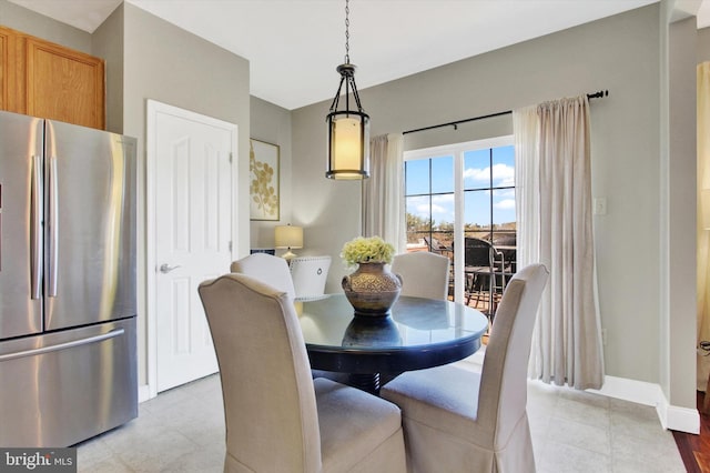 dining area featuring baseboards