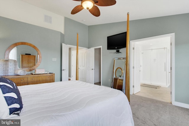 carpeted bedroom featuring visible vents, lofted ceiling, baseboards, and a ceiling fan