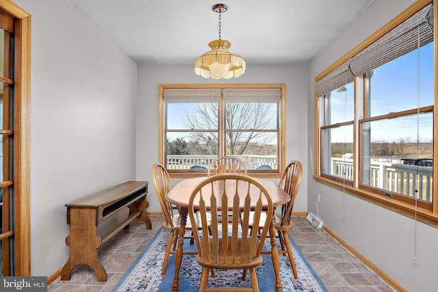 dining room featuring baseboards and visible vents