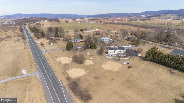 birds eye view of property featuring a rural view and a mountain view