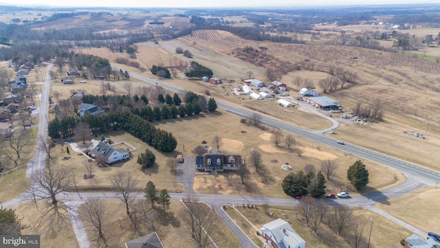 birds eye view of property featuring a rural view