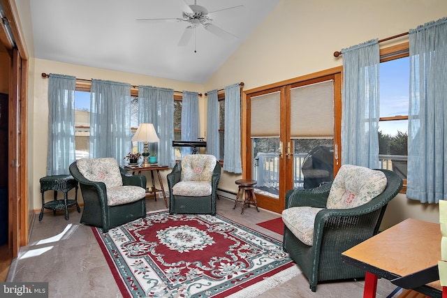 living area featuring plenty of natural light, high vaulted ceiling, baseboard heating, and a ceiling fan