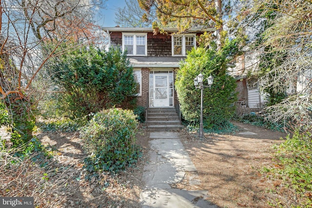 view of front of property featuring brick siding