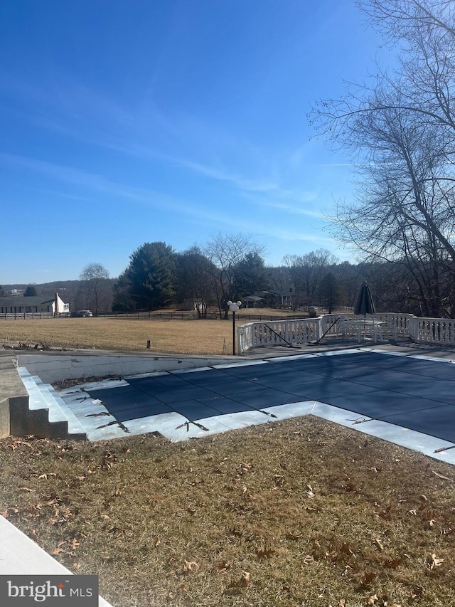 view of pool featuring a patio, a lawn, and a fenced in pool