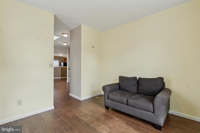 sitting room featuring wood finished floors and baseboards