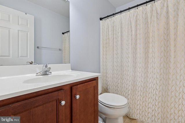 full bathroom featuring toilet and vanity