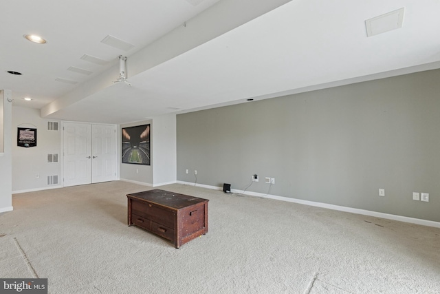 unfurnished living room with baseboards, visible vents, and recessed lighting