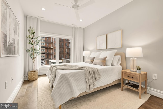 bedroom featuring recessed lighting, visible vents, baseboards, and wood finished floors