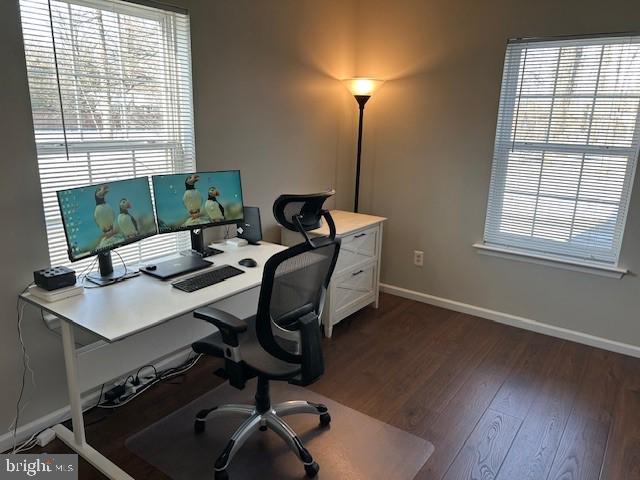 home office featuring baseboards and dark wood-style flooring