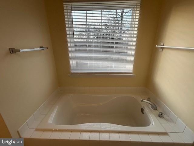 bathroom with a garden tub