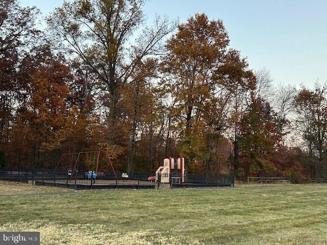 view of yard with fence and playground community